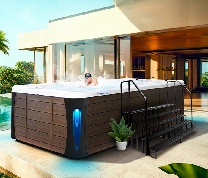 Calspas hot tub being used in a family setting - Green Lawn